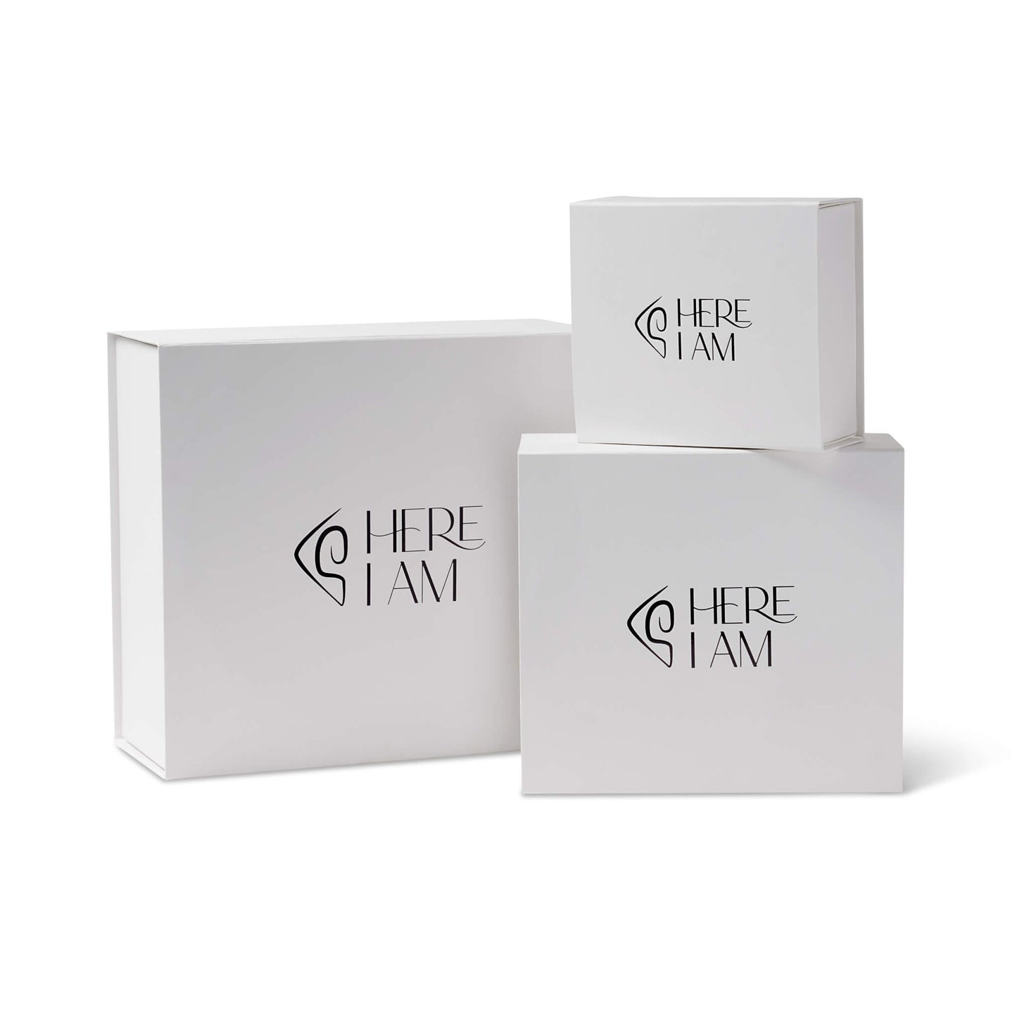 Three white boxes with 'HERE I AM' branding on a white background