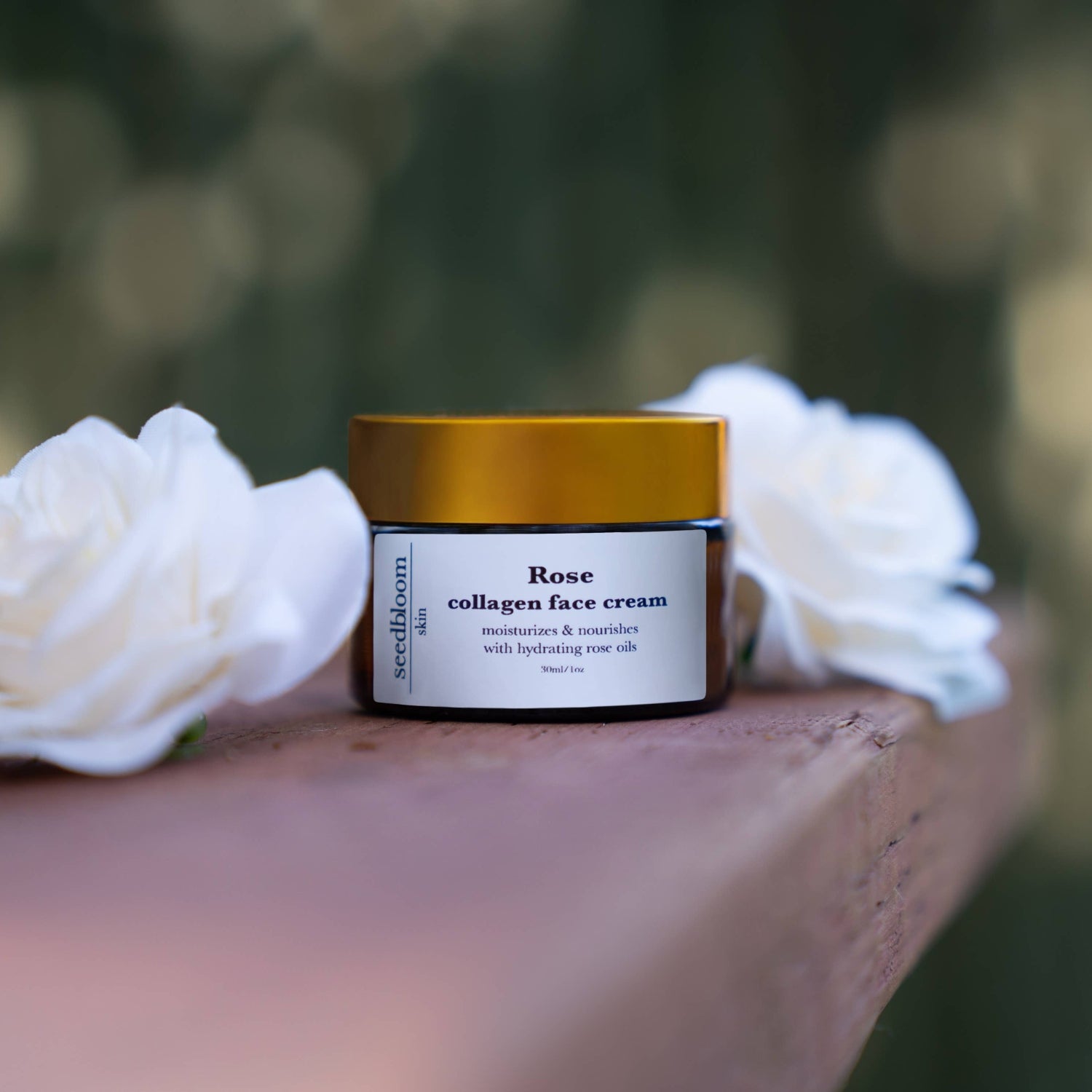 The vegan collagen face cream from seedbloom on a shelf with white roses