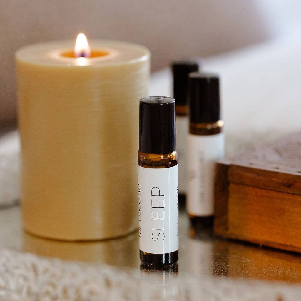 Aromatherapy Sleep Oil  next to candle