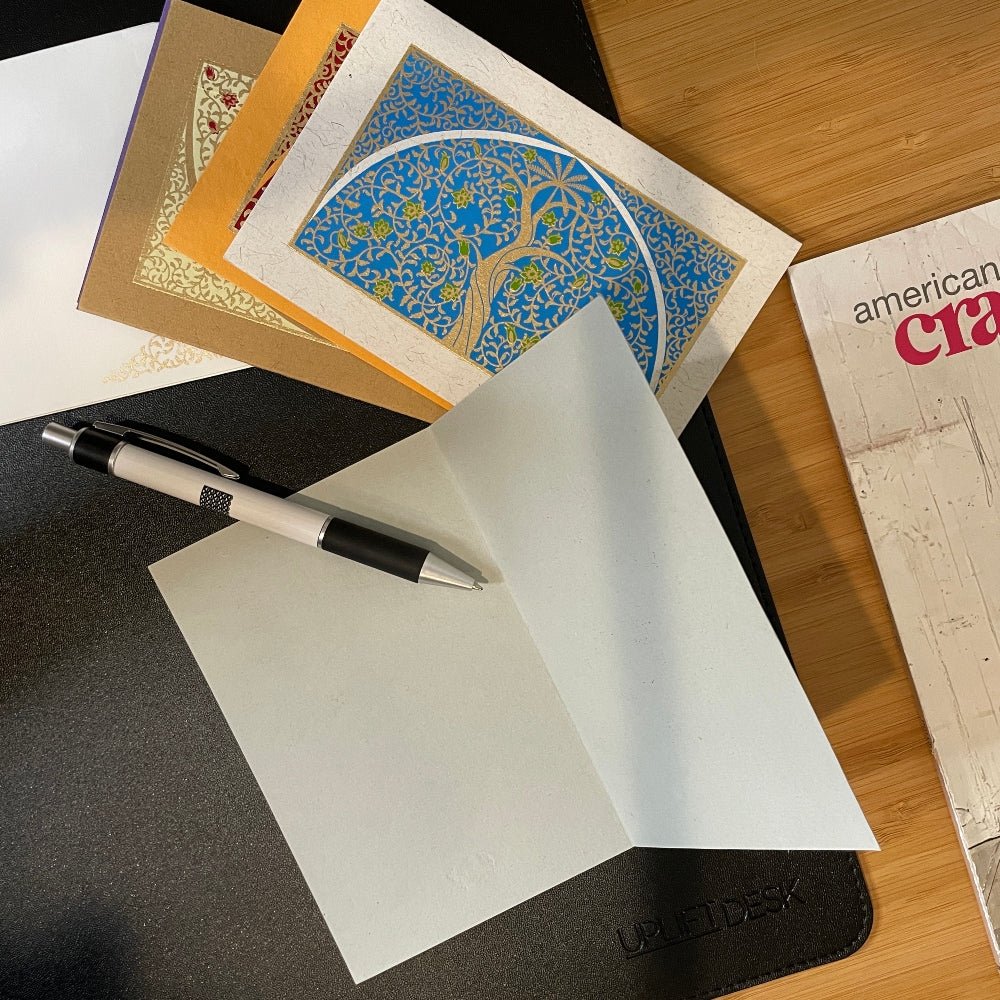 Inside of the Upavan Notecard on desk with several other cards nearby