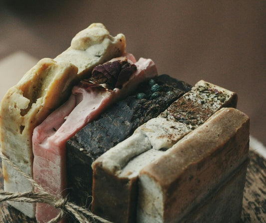 A variety of Handmade Natural Soap Bars tied together with twine