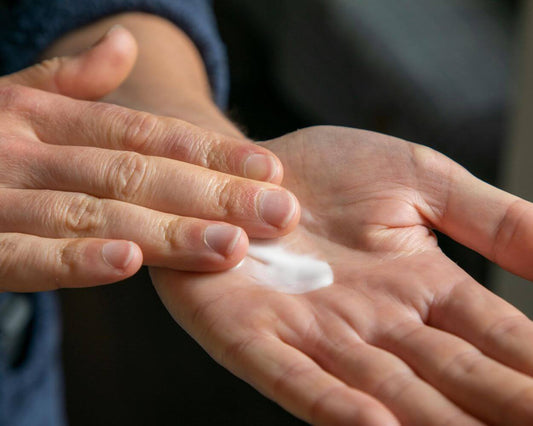 Hands with natural body lotion for healthier skin