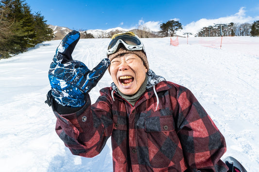 Woman having the time of her life snowboarding 