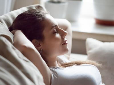 Woman resting to treat chronic stress