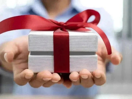 The Best Stress Relief Presents are in a white box and red bow