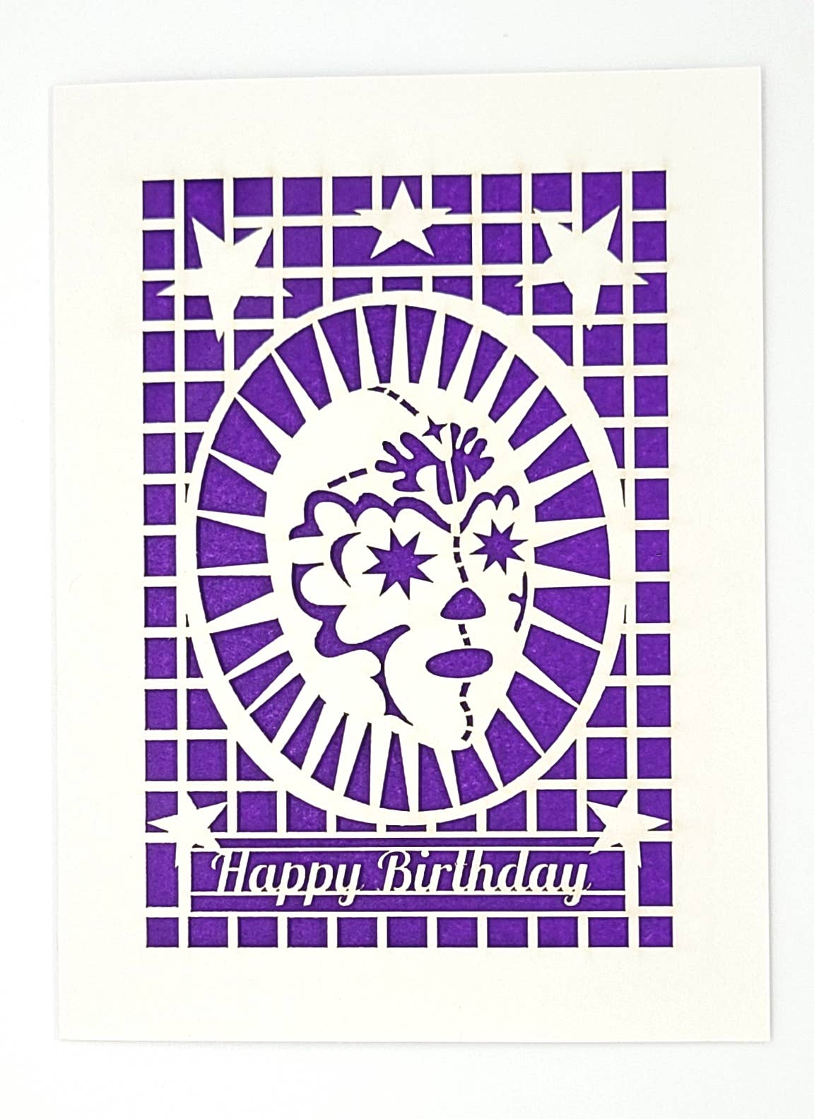 Happy Birthday Greeting card with a laser cut design of a Luchadore on white with a purple background