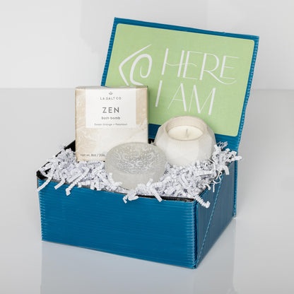 Blue box containing a candle, dish, and Zen bath bomb.