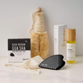 Flow Box — dry brushing, gua sha, and body oil bundled into one at-home ritual kit
