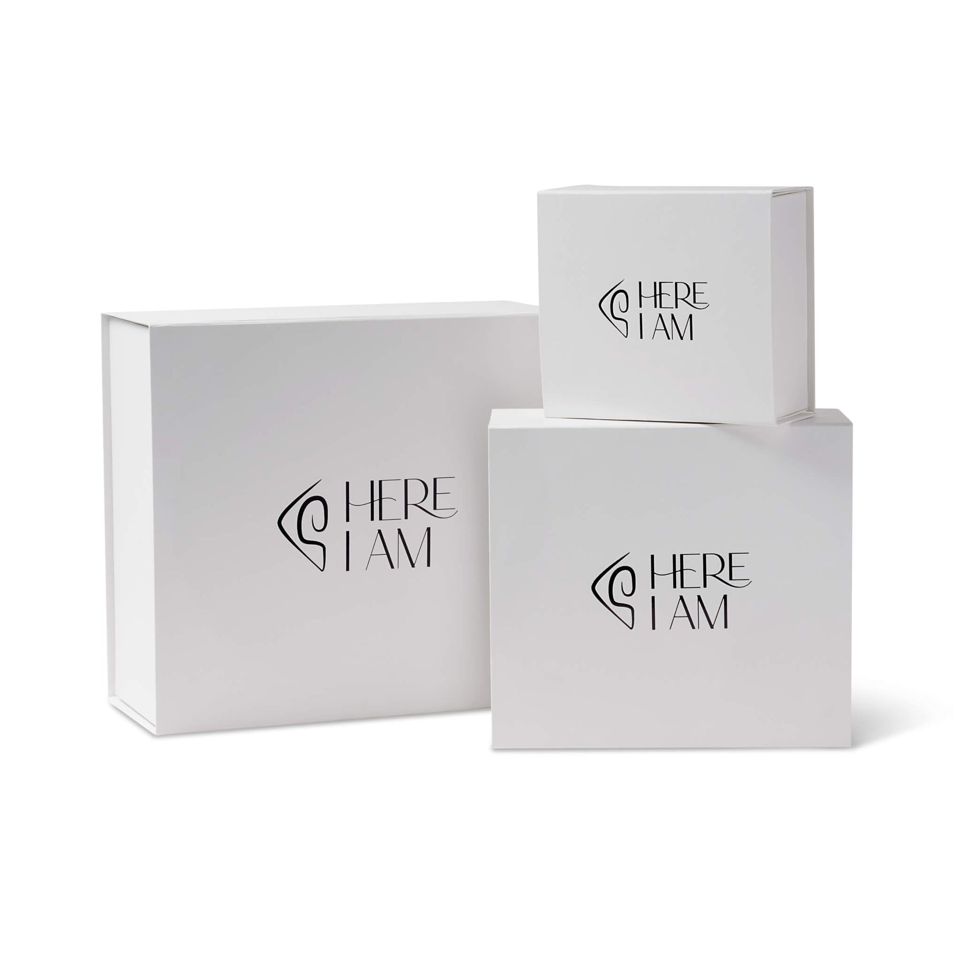 Three white boxes with 'HERE I AM' branding on a white background