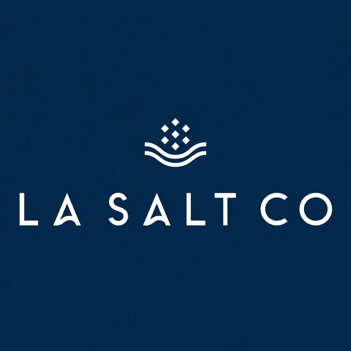 Logo for the LA Salt Co in white letters on a dark blue background