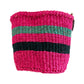 Woven jute basket in pink, teal, and dark blue