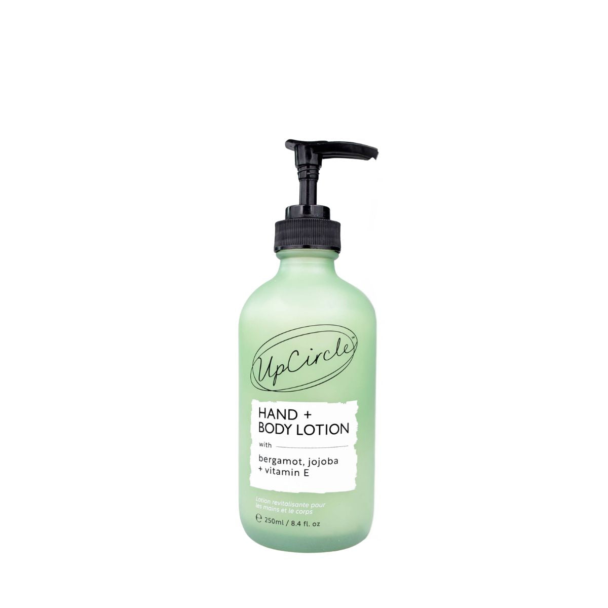 A 250ml pump bottle of UpCircle Hand & Body Lotion with a light green translucent body and a black pump dispenser, shown on a plain white background.