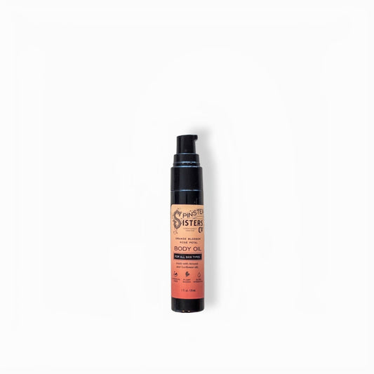 Small bottle of body oil on white background