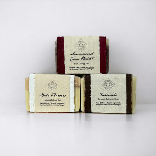 Three bars of organic soap from Unearth Malee: Sandalwood, Bali Flowers, and Turmeric