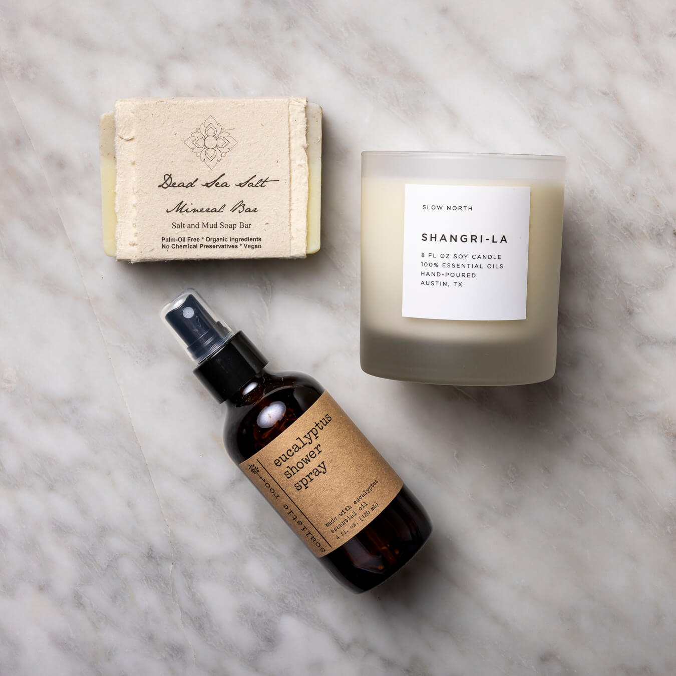 Dead Sea Minerals Organic Soap, Shangri-La Frosted Candle, and Eucalyptus Shower Mist.