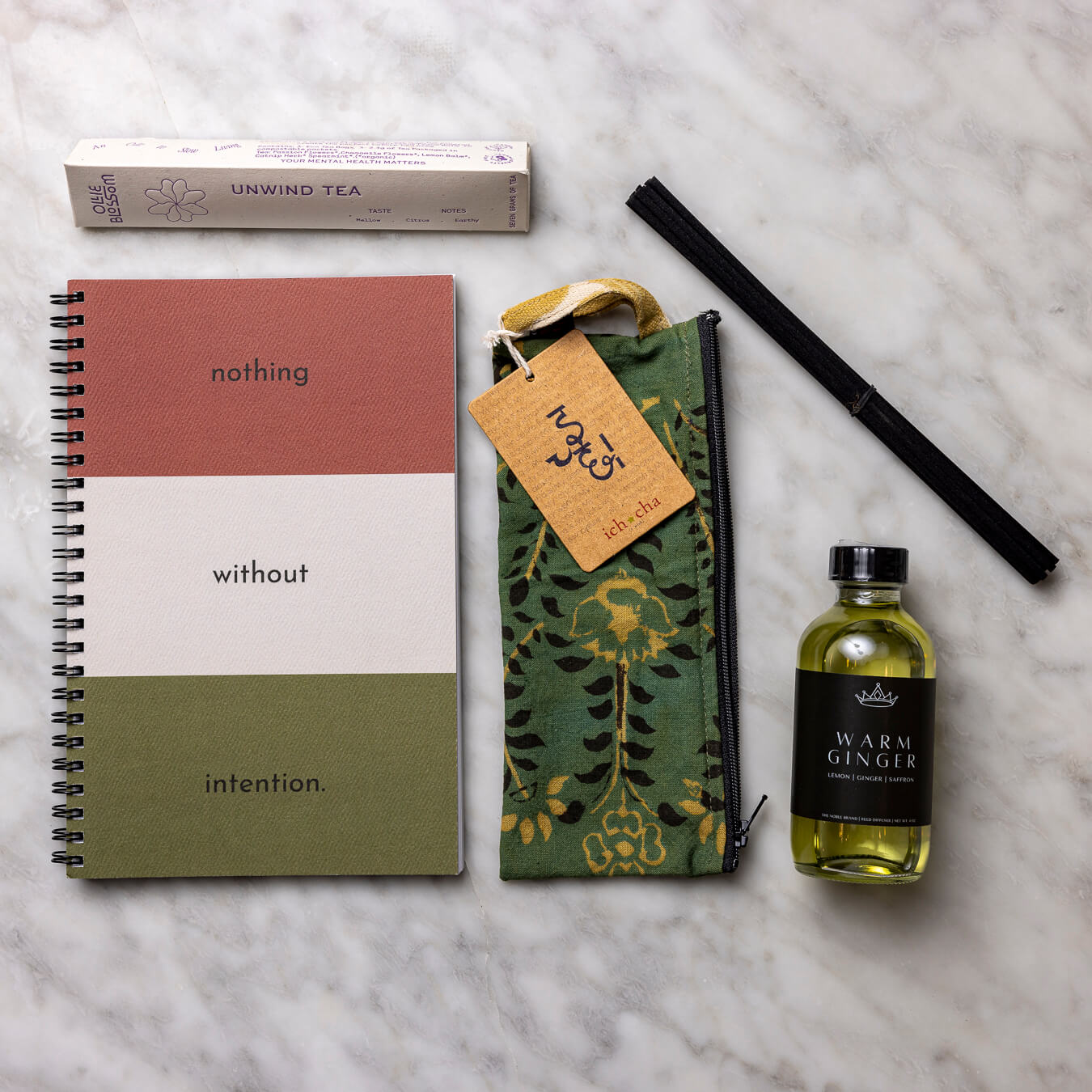 Intention Journal, pencil holder, Unwind Tea, and Reed Diffuser.