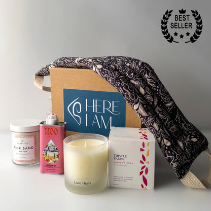 Contents of the Rest & Relaxation Gift Box including weighted neck wrap, candle, oil, and Pink Sand bath soak