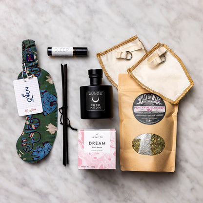 Dream Bath Bomb, eye mask, Roll-on Aromatherapy, tea and filters, and Reed Diffuser.