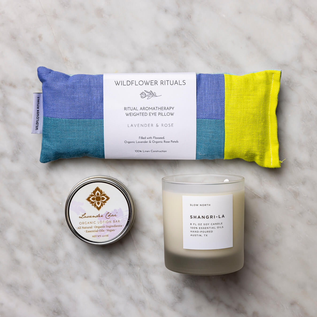 Lavender Chai Organic Lotion Bar, Lavender & Roses Eye Pillow, and Shangri-La Frosted Candle.