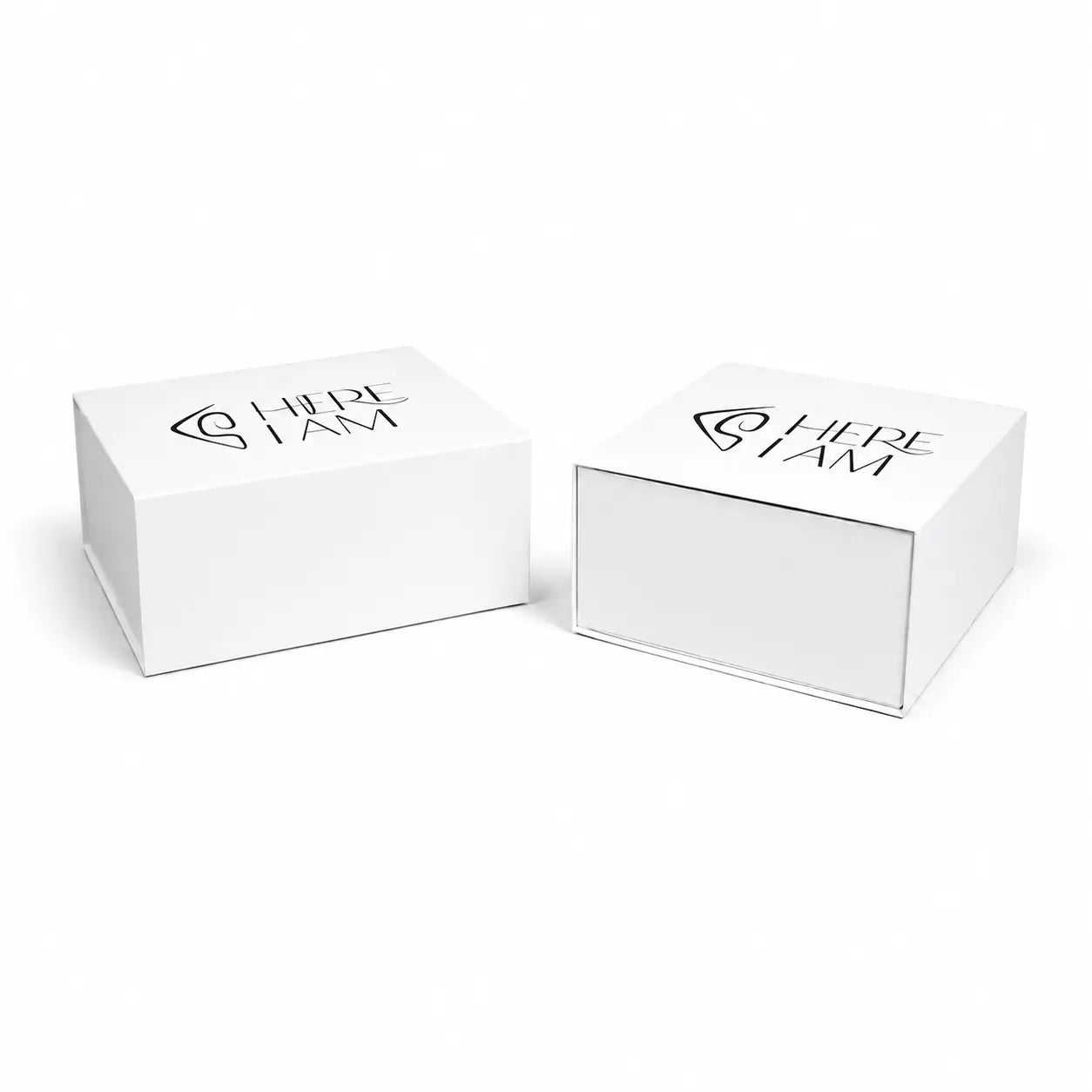 Two white boxes with 'HERE I AM' branding on a white background