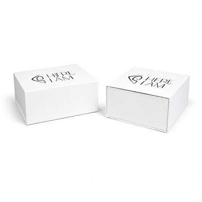 Two white boxes with 'HERE I AM' branding on a white background