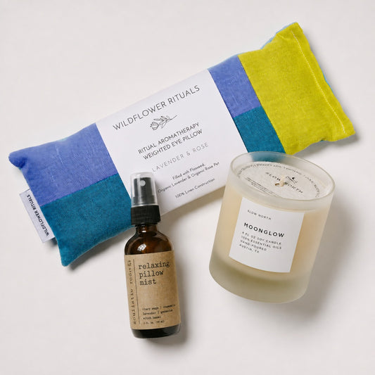 Items for a Pause, including the Moonglow Essential Oil Candle, Lavender and Chamomile Pillow Spray, and Lavender & Rose eye pillow