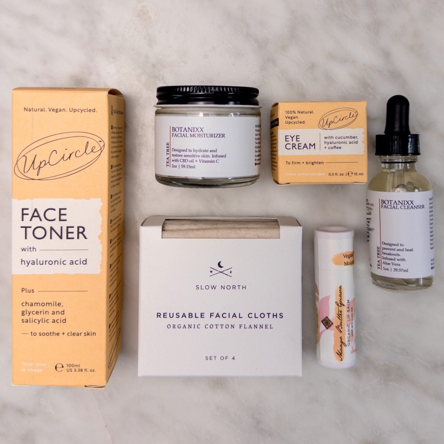 Rise & Shine skincare routine including face toner and eye cream, cleanser and moisturizer, reusable cloths, and lip balm