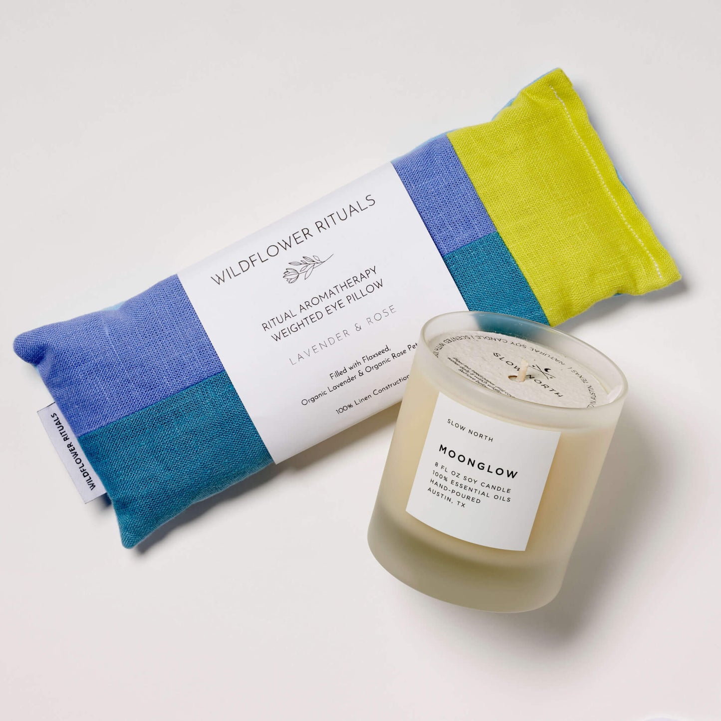 Items for a Pause, including the Moonglow Essential Oil Candle and Lavender & Rose eye pillow