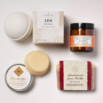 Collection of wellness products from the Zen Moment box on a tile background.