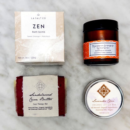 Collection of wellness products from the Zen Moment box on a granite background.