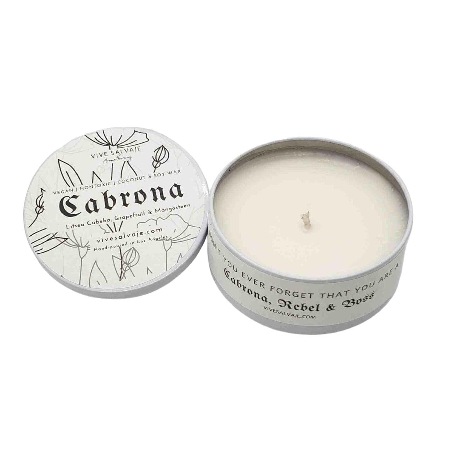 The Cabrona candle with the lid off on a white background