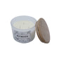 Three wick candle with bamboo lid on a white background