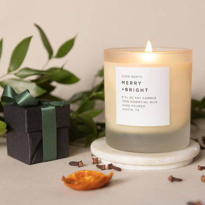 Merry + Bright essential oil candle from Slow North with small gift package