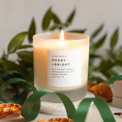 Merry and Bright essential oil candle with ribbons and dried oranges