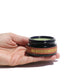 Hand holding an open jar of the Goji Nectar Cleansing Balm