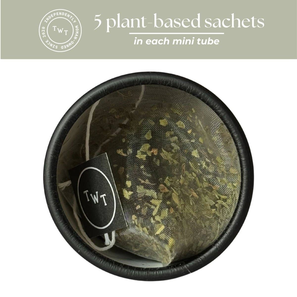 Round black container with plant-based sachets and TWT label on a light gray background