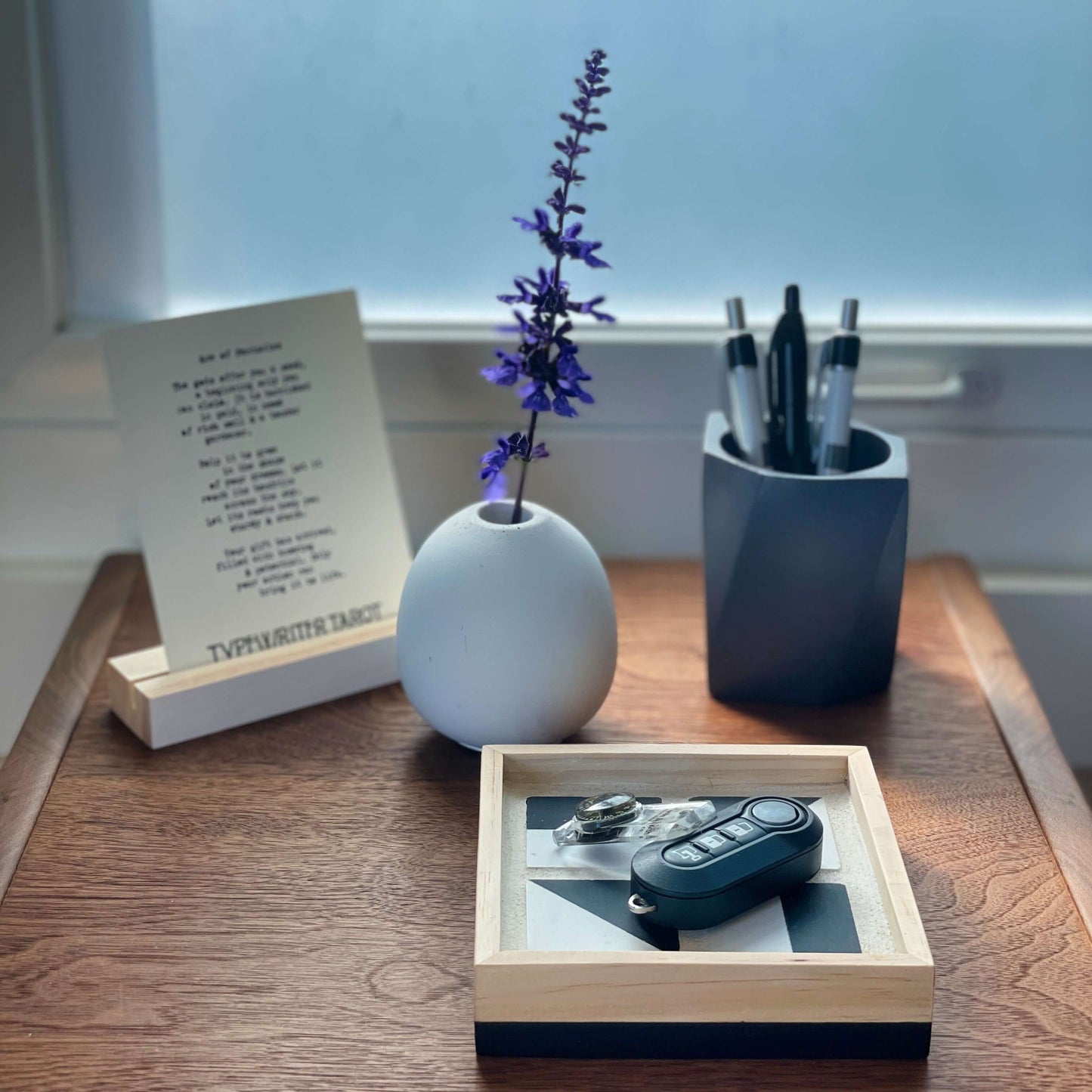 The Geometric planter used as a pen holder on a desk with other decor