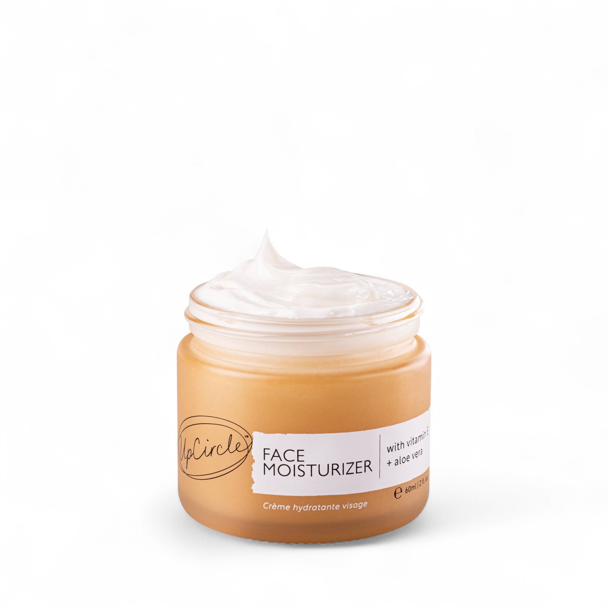Open jar of Vitamin E Face Cream with Aloe Vera from UpCircle Beauty on white background