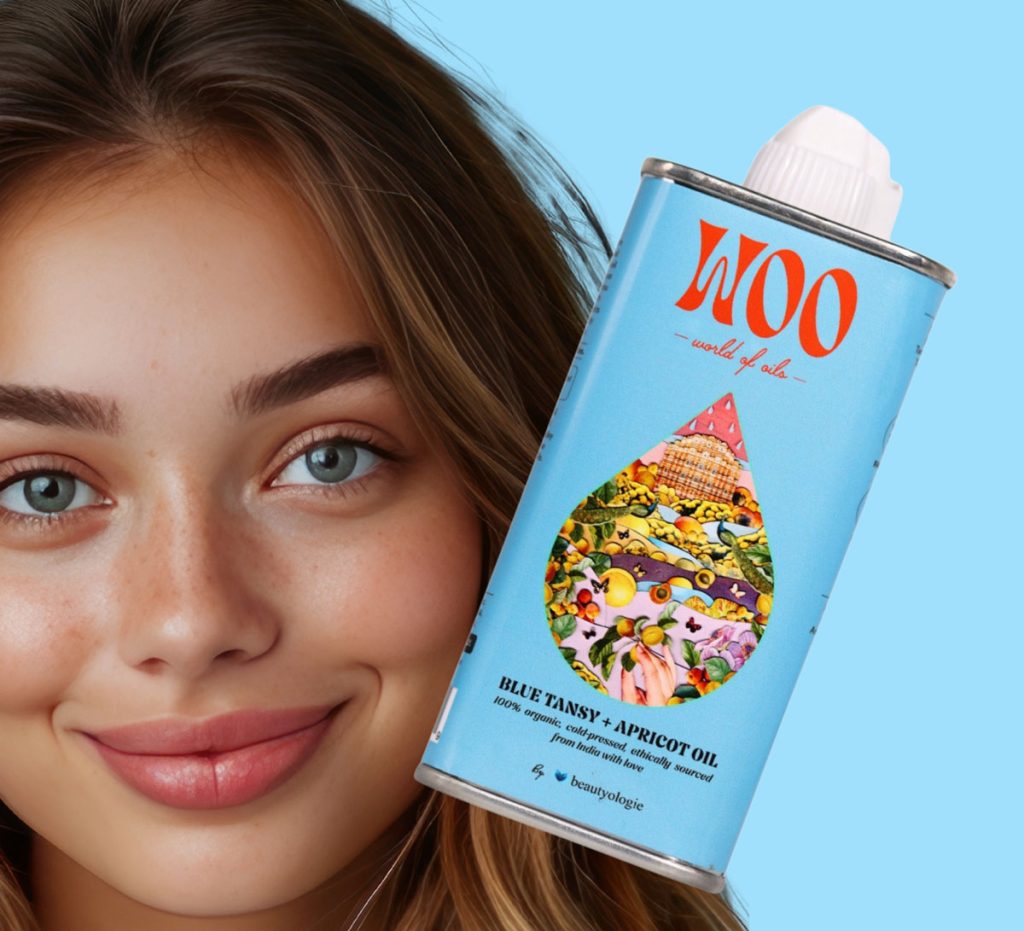 Smiling woman with tin can of WOO Blue Tansy oil