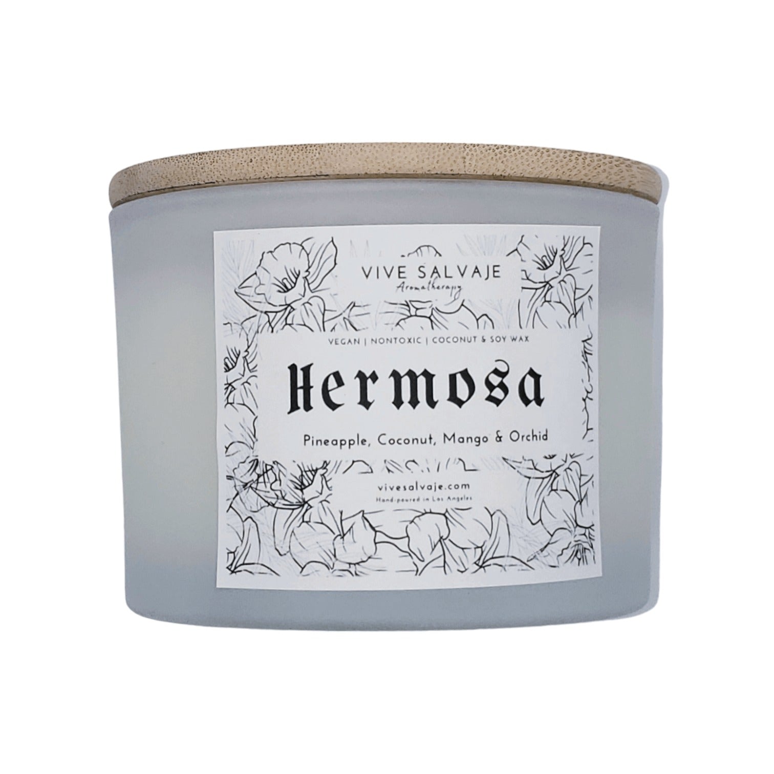 Hermosa candle in frosted white vessel with a bamboo lid from Vive Salvaje