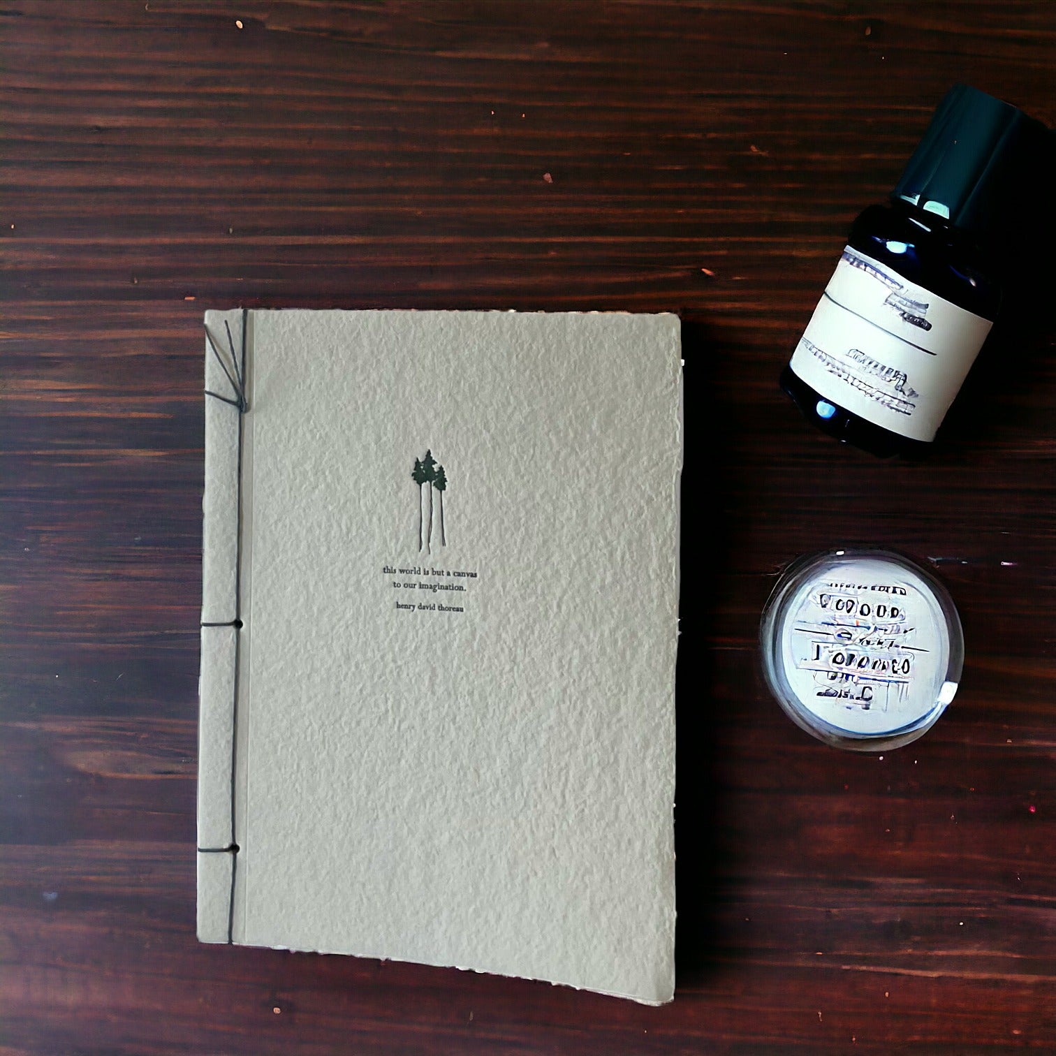 Handmade paper journal on desk with ink