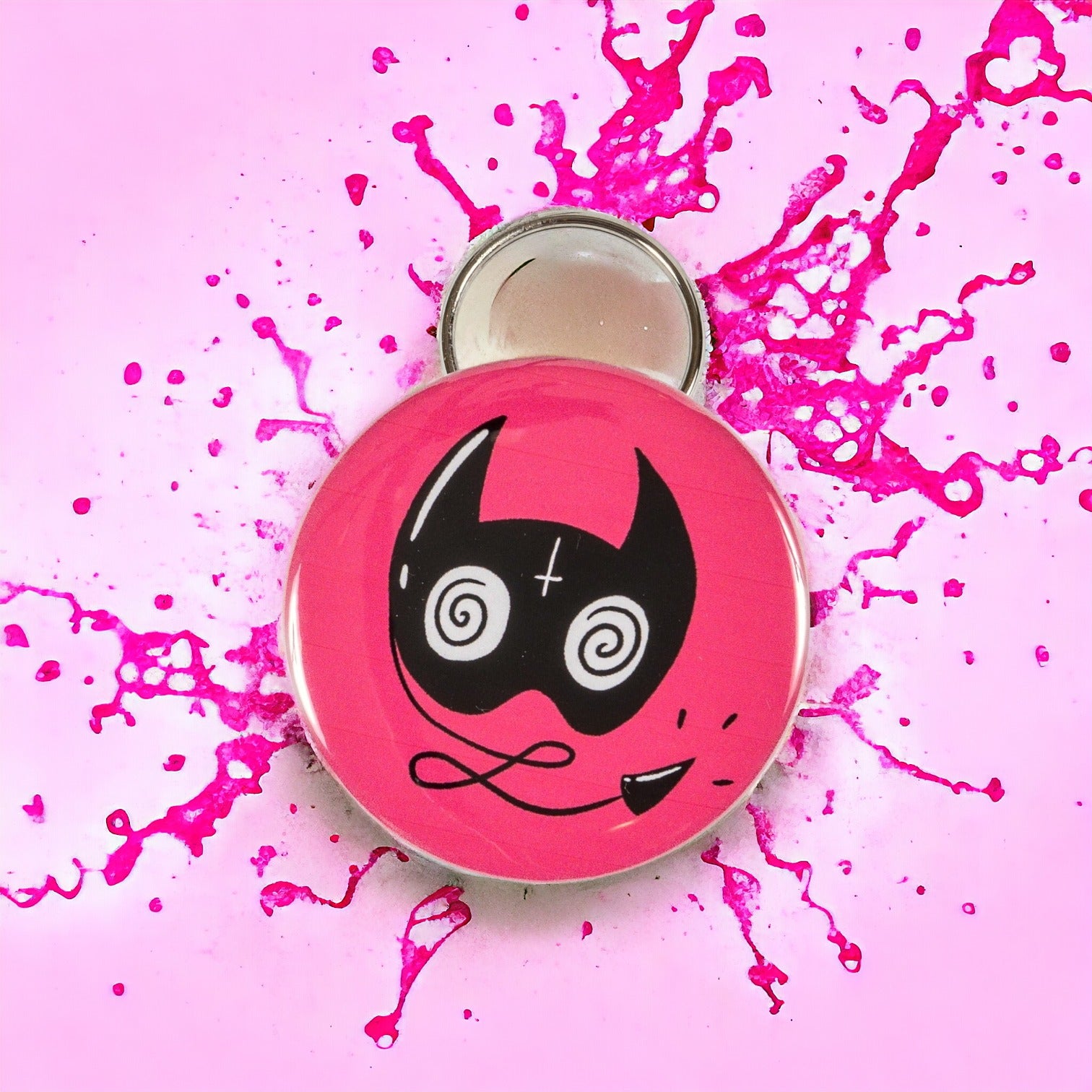 Combo keychain and bottle opener with a sassy cat mask on a pink background