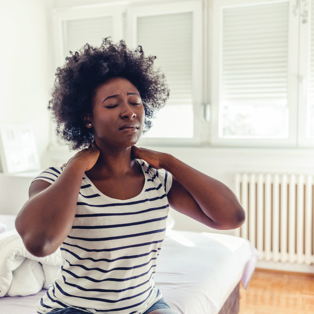 Woman waking up with neck pain