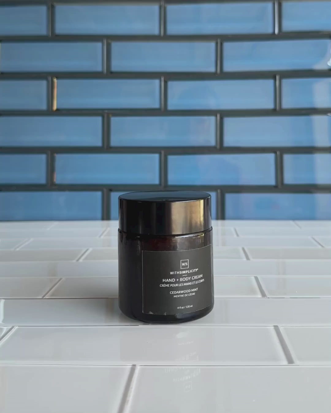 Video of woman opening jar of the Cedarwood Mint Body Lotion