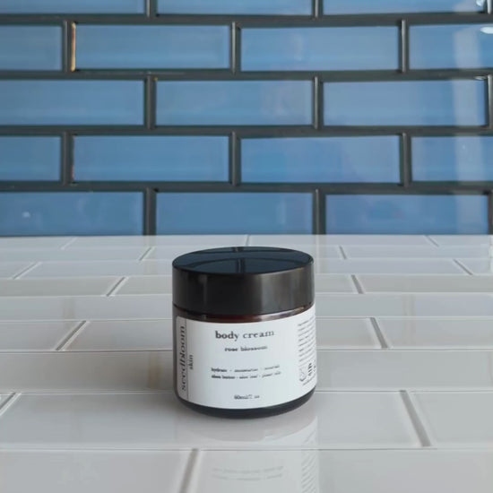 Video of woman opening jar of floral body lotion