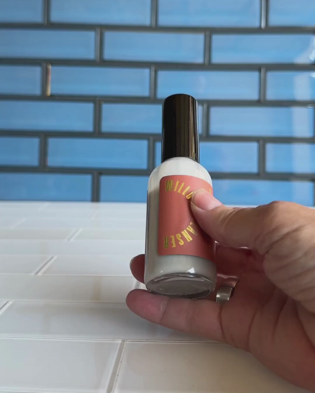 Woman demonstrating use of the Willow Cleanser