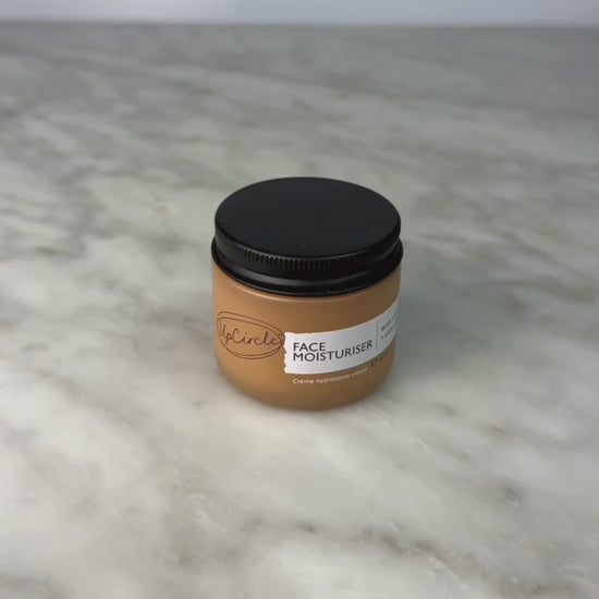 Video of woman opening jar of the UpCircle Face Cream