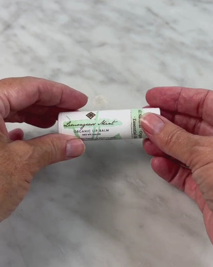 video of woman opening the Lemongrass Mint Lip Balm from Unearth Malee