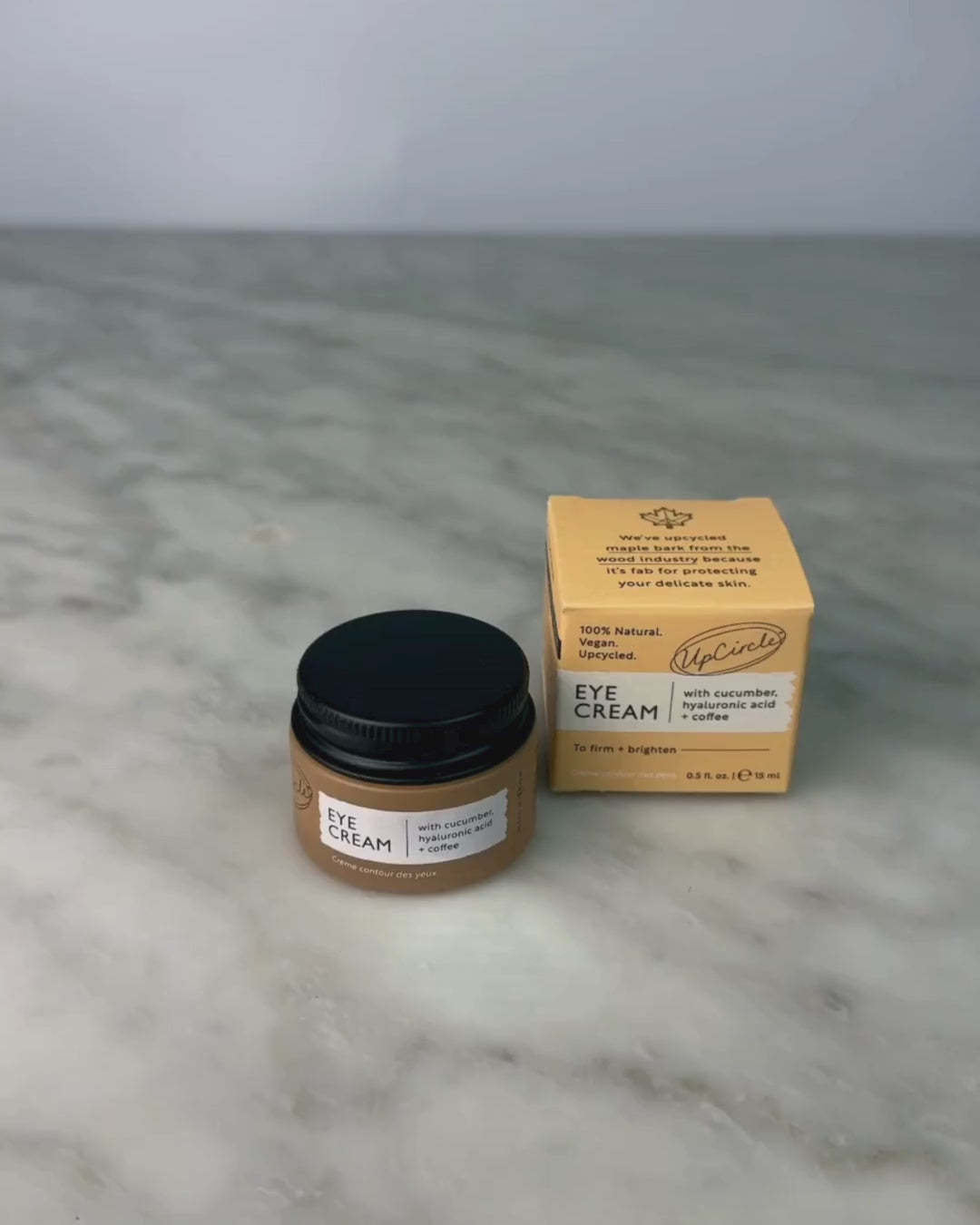 Video of woman opening jar of Eye Cream with Hyaluronic Acid & Coffee Oil