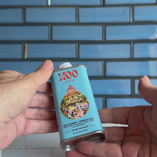 Video of a woman using the Blue Tansy & Apricot Oil from WOO 